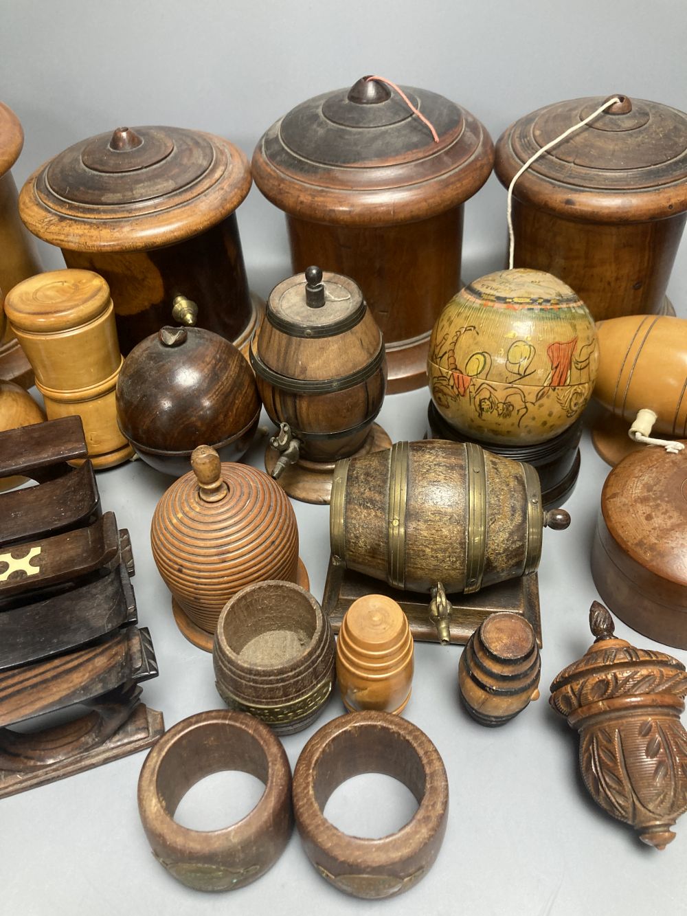 Five lignum vitae string dispensers, other treen ornaments, a parquetry box etc.